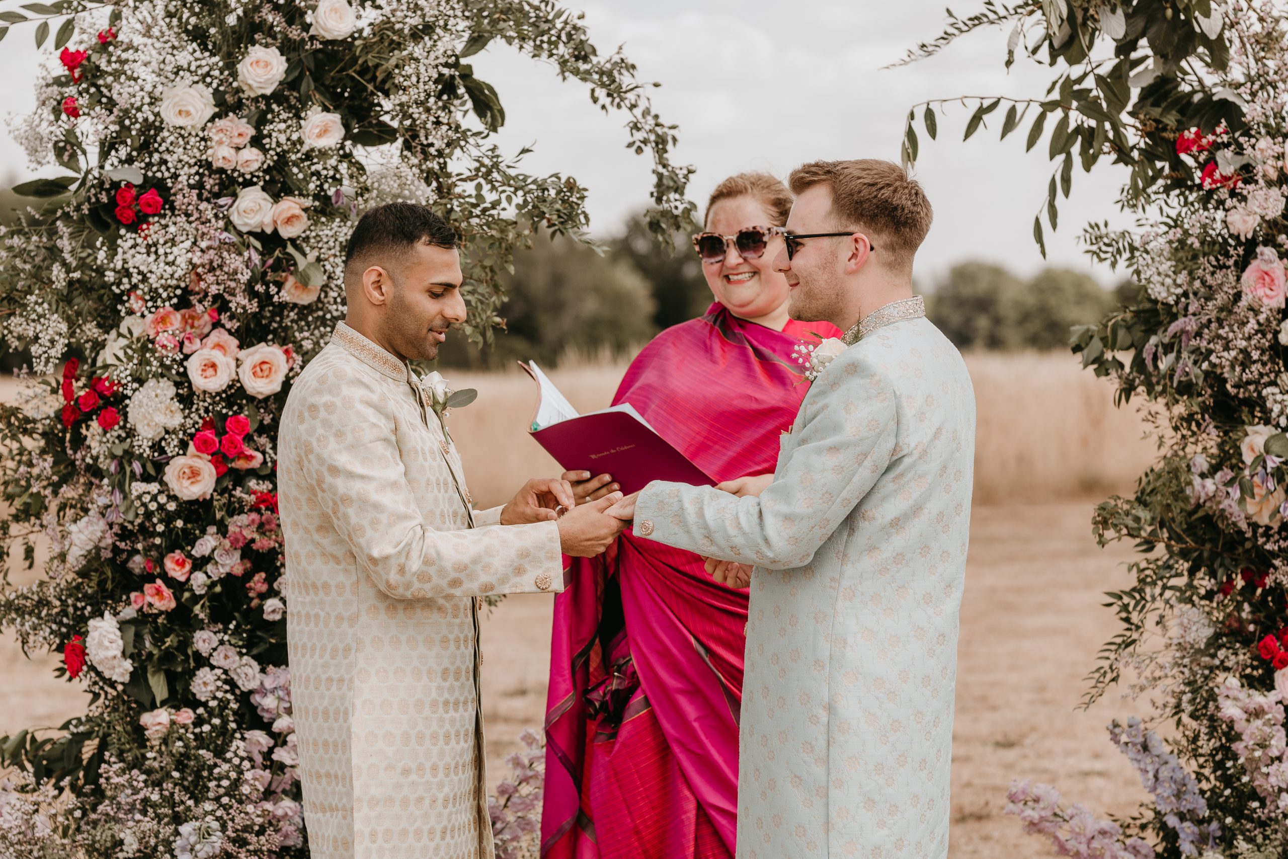 Couple exchanging vows at outdoor ceremony.