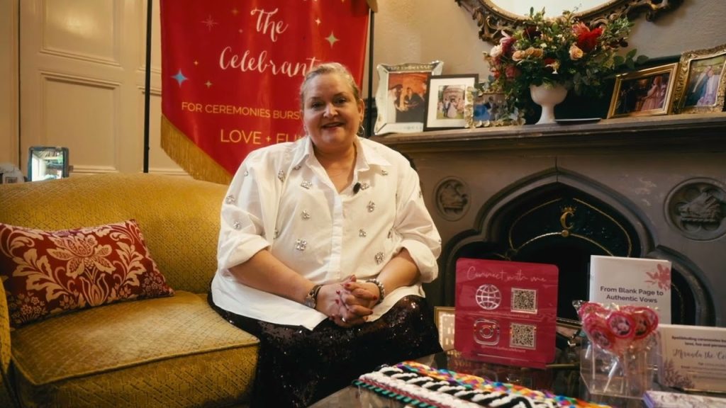 miranda the celebrant seated in a cosy room.