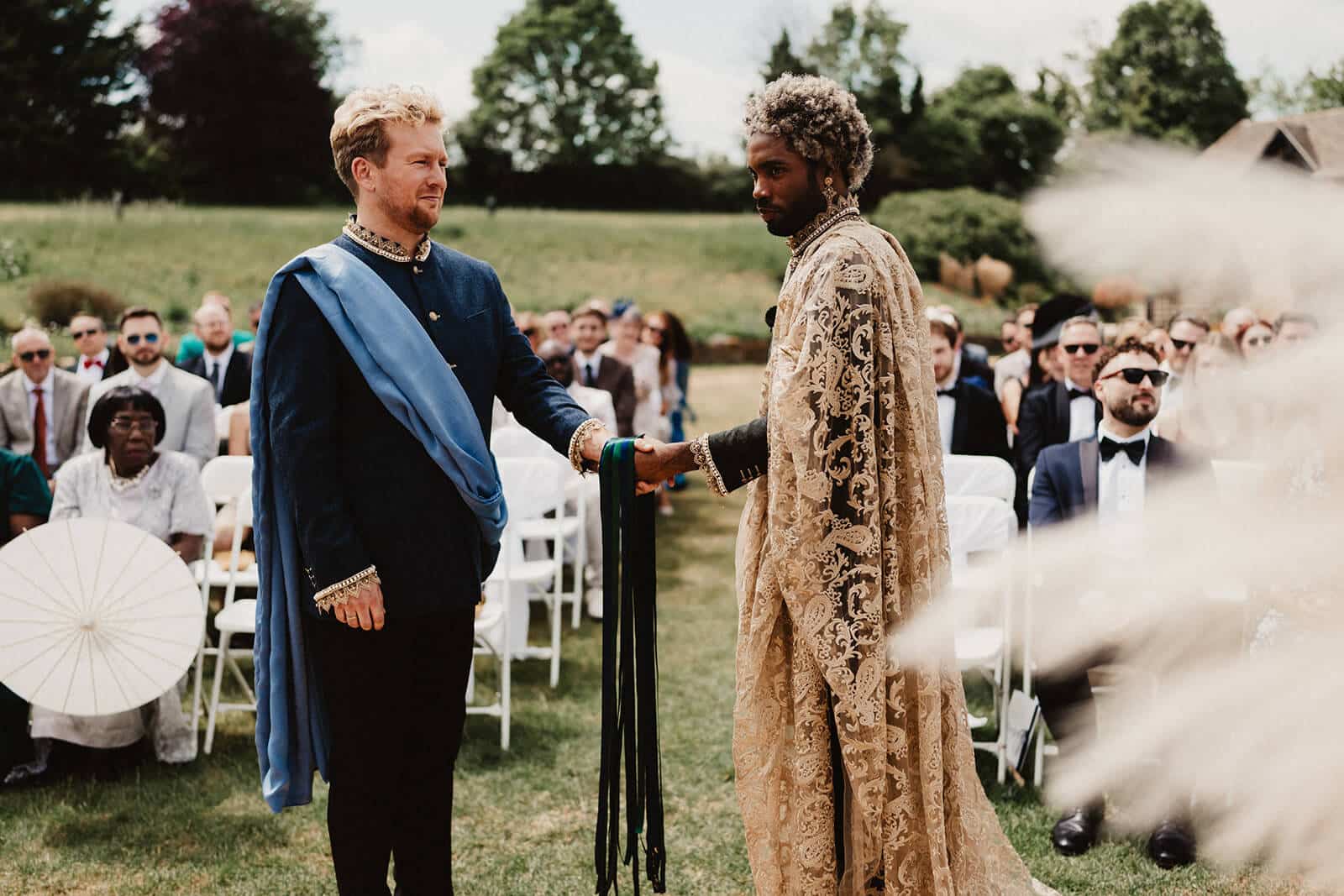 Two individuals in formal attire. Celebrant vs registrar