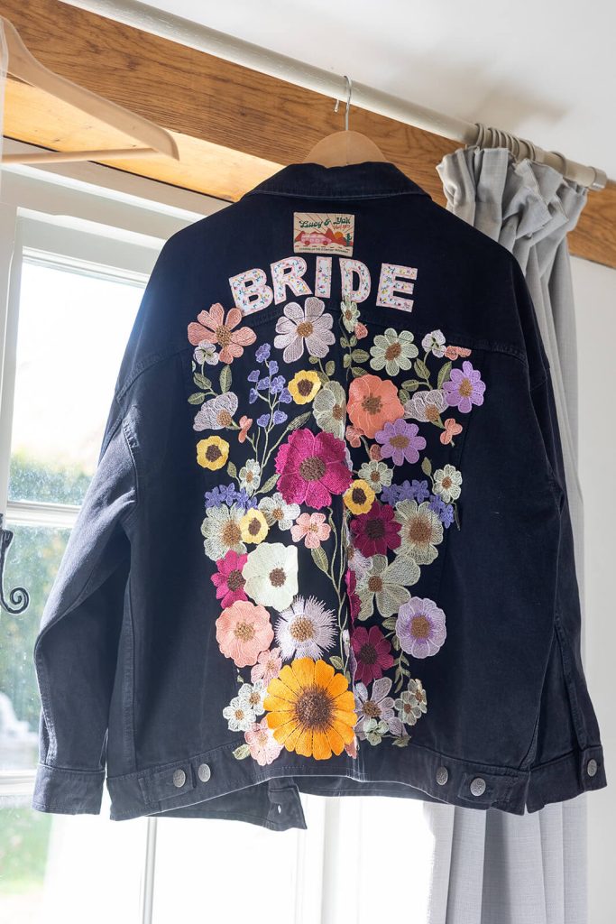 Denim embroidered jacket with bride words on it