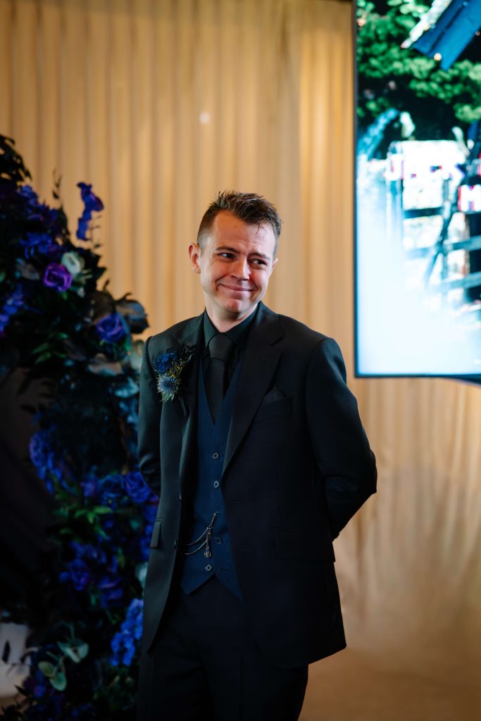 Emotional groom seeing bride