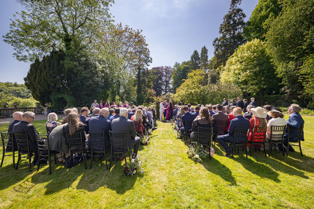 Outdoor wedding ceremony with guests