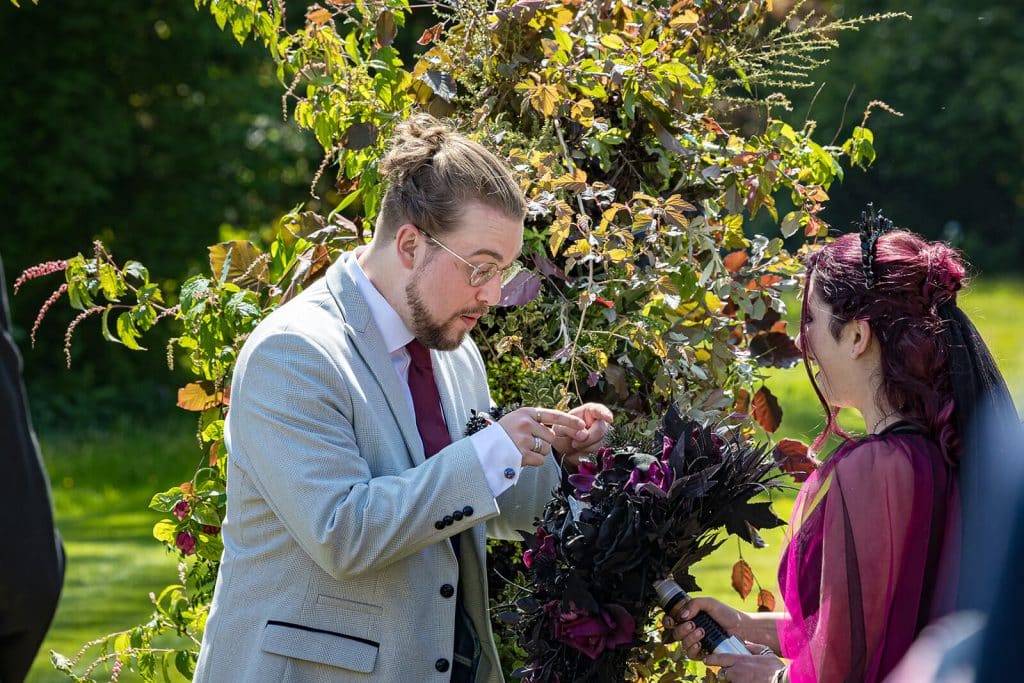 Couple exchanging vows in nature.