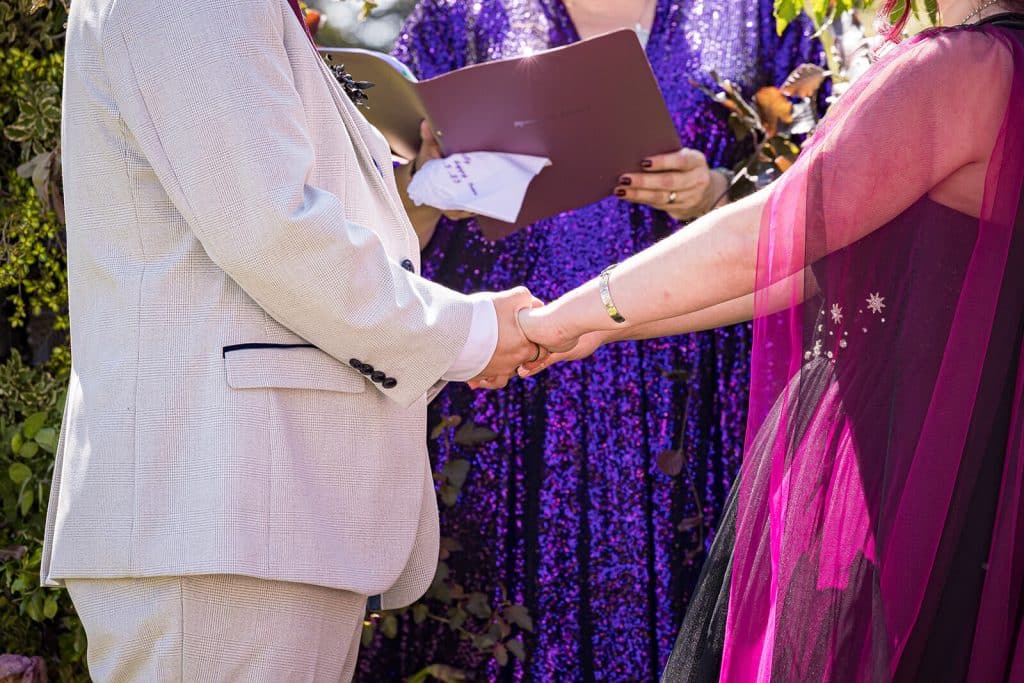 Couple exchanging vows during ceremony.