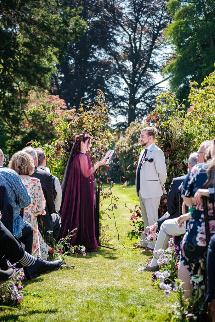 Outdoor wedding ceremony with guests