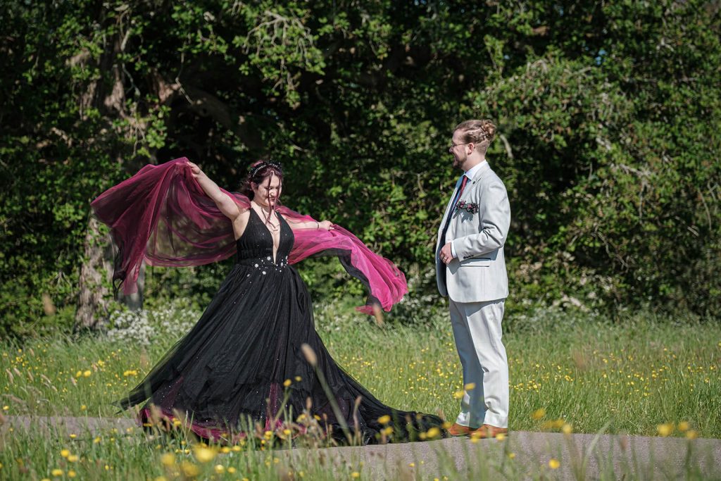 Couple in formal attire outdoors.