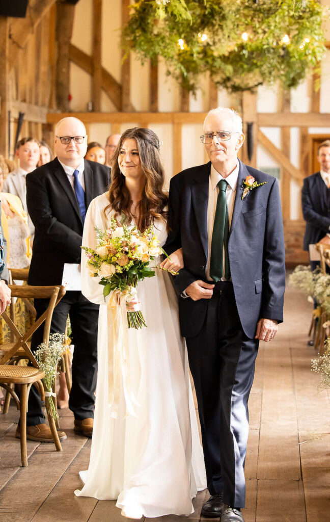 Miranda the Celebrant | Hampshire Ceremonies Bride walking with her father at Gatestreet Barn