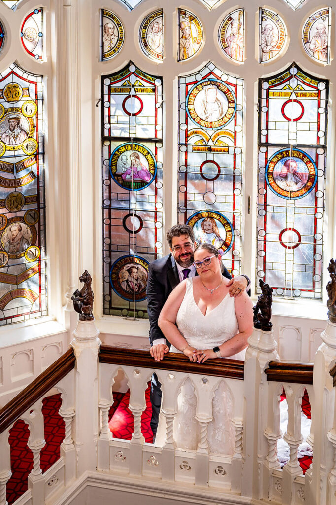 Miranda the Celebrant | Hampshire Ceremonies Couple posing by stained glass windows.