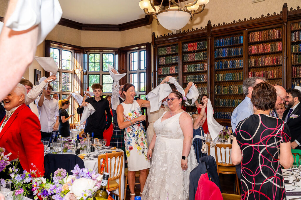 Miranda the Celebrant | Hampshire Ceremonies Celebration with guests waving napkins.