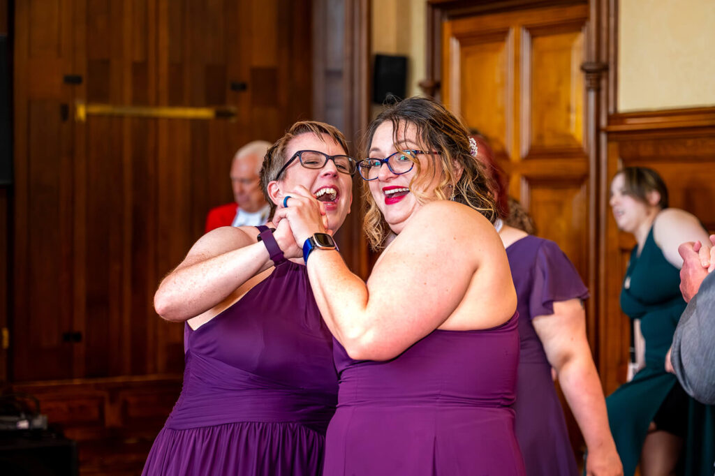 Miranda the Celebrant | Hampshire Ceremonies Two women joyfully dancing together.