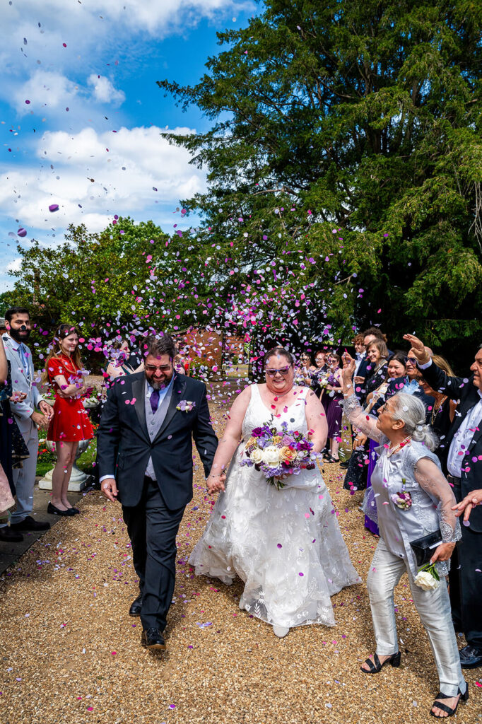 Miranda the Celebrant | Hampshire Ceremonies Couple celebrating wedding with confetti.