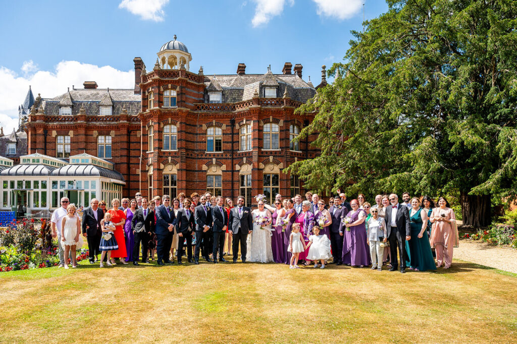 Miranda the Celebrant | Hampshire Ceremonies Wedding party in front of The Elvetham