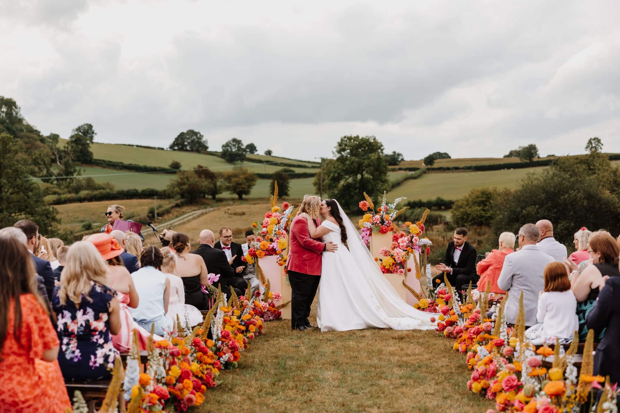 Couple exchanging vows at outdoor wedding.