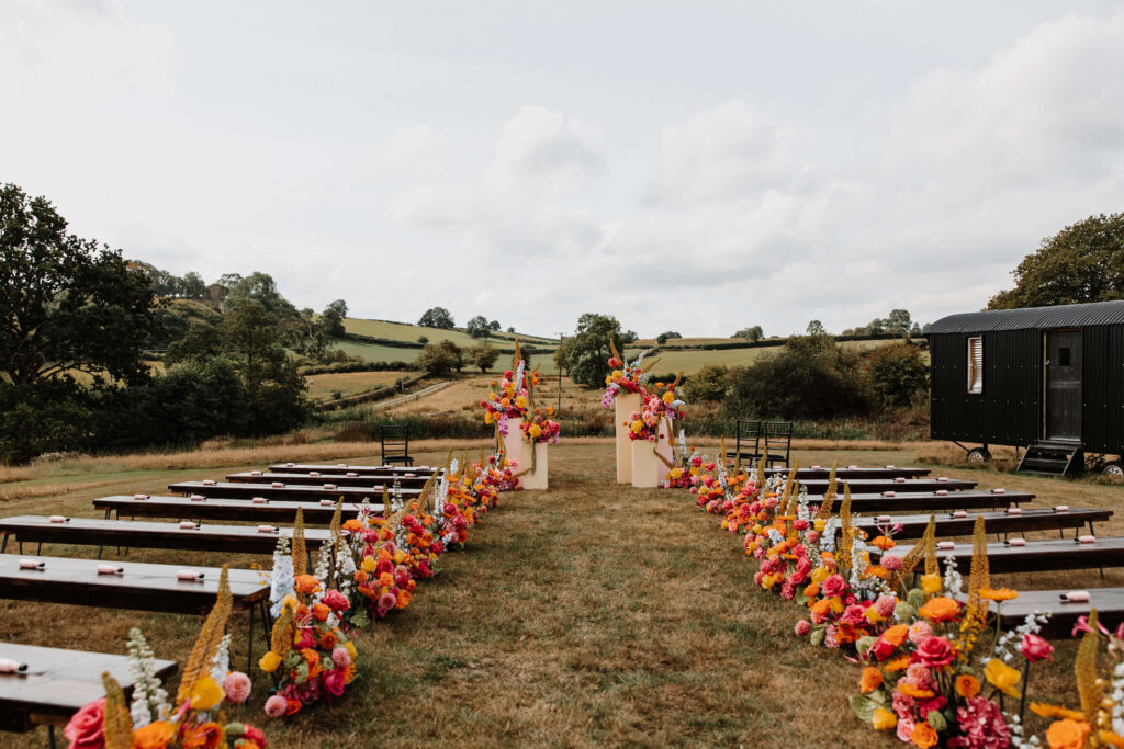 Colourful floral wedding ceremony setup