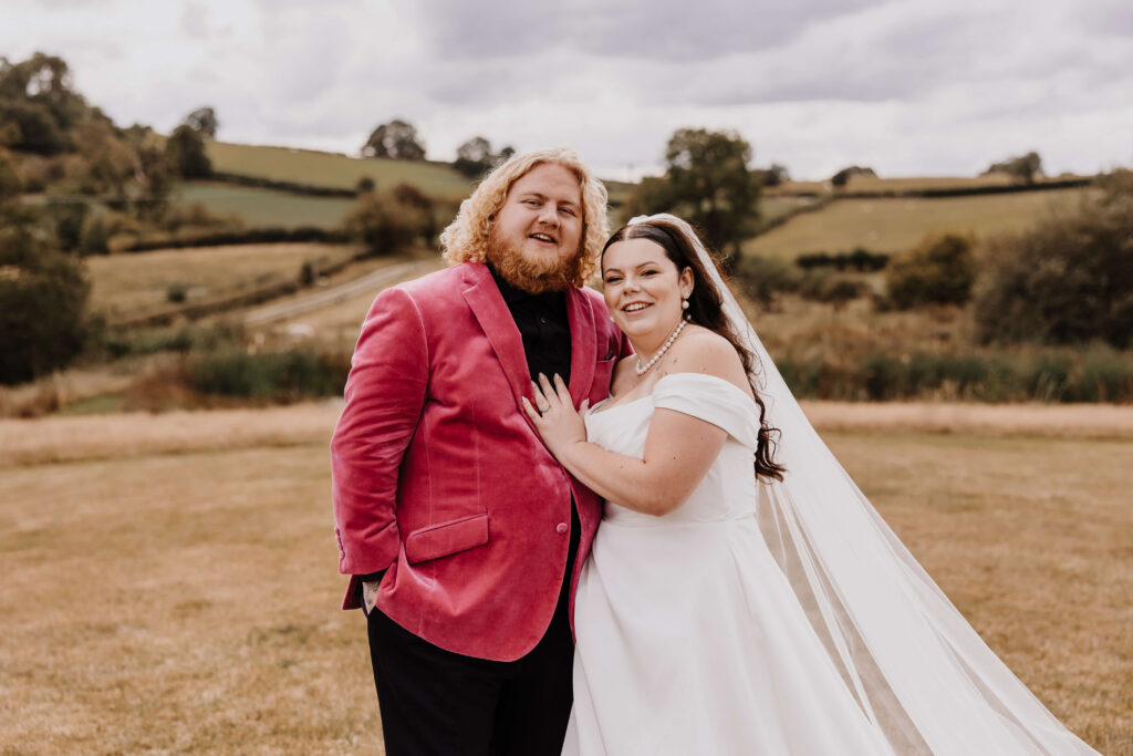 Couple celebrating wedding in Welsh countryside at The Giraffe Shed