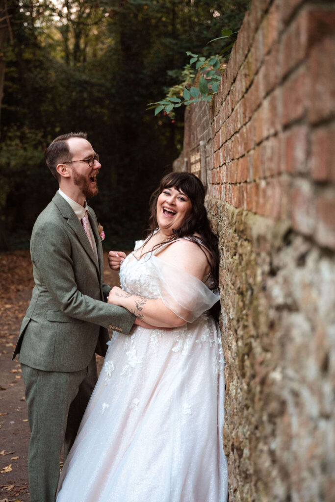 Miranda the Celebrant | Hampshire Ceremonies Happy couple by a brick wall