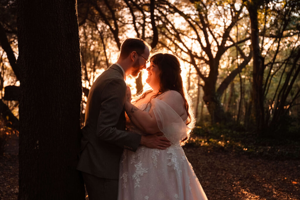 Couple embracing in golden sunset glow at The Alverbank Hotel.