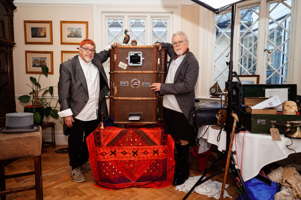 Miranda the Celebrant | Hampshire Ceremonies Two men with vintage suitcase display.