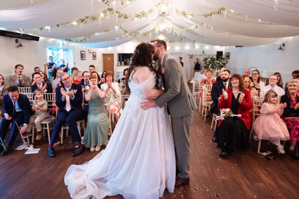 Miranda the Celebrant | Hampshire Ceremonies Couple kissing at wedding ceremony.