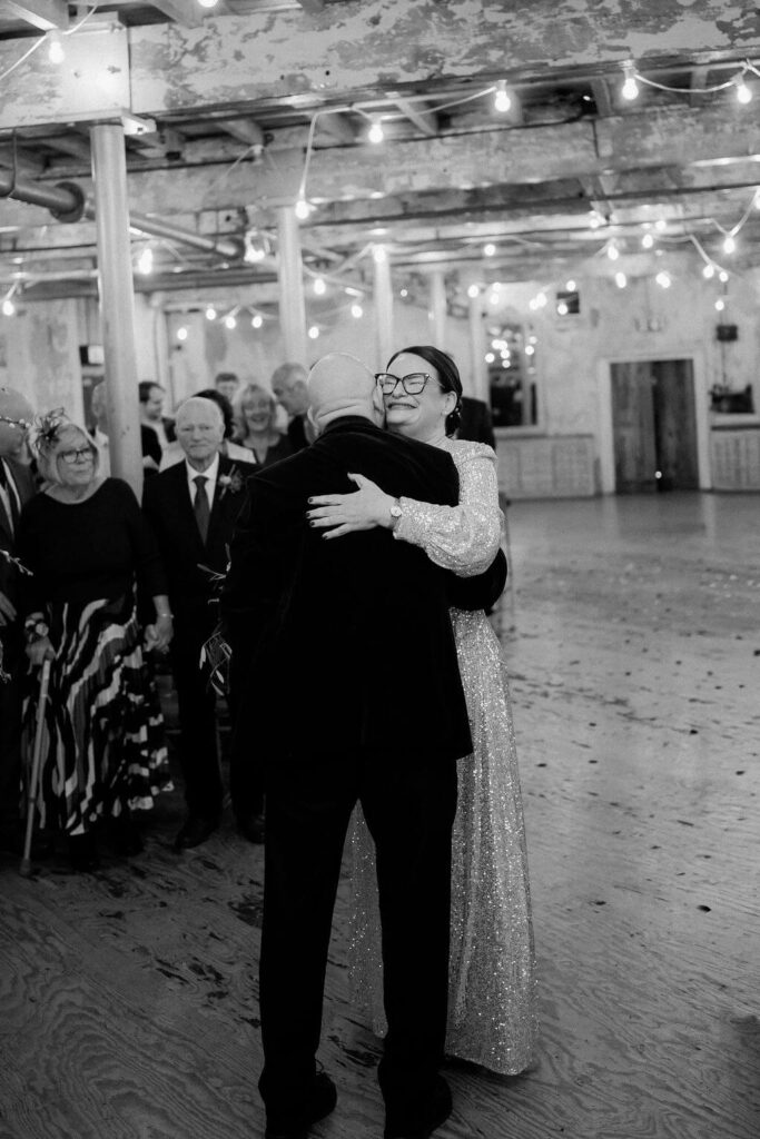 Couple embracing in a celebration.