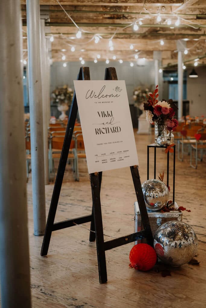 Colourful Wedding welcome sign and decorations.